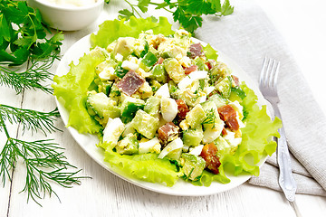 Image showing Salad of salmon and avocado on board