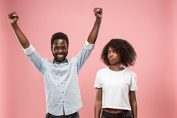 Image showing Couple watching sports match on tv at home, celebrating victory, successful game