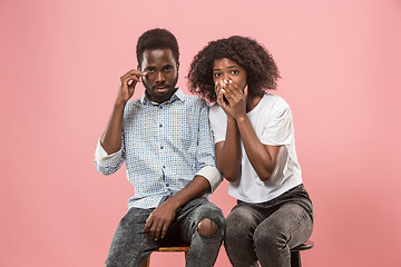 Image showing Couple surprised watching sports match on tv at home, unsuccessful game