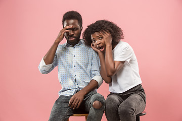 Image showing Couple surprised watching sports match on tv at home, unsuccessful game