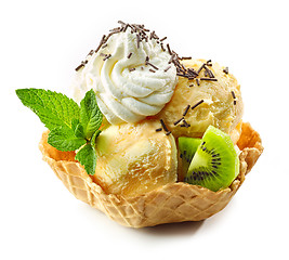 Image showing orange ice cream in waffle basket