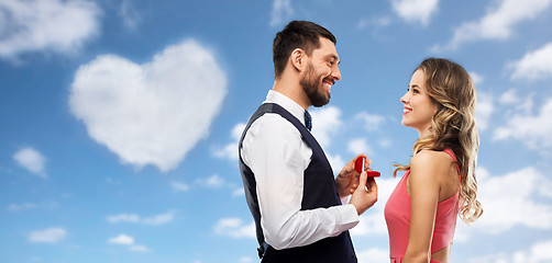 Image showing man giving woman engagement ring on valentines day