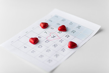 Image showing close up of calendar and heart shaped candies