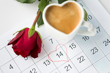 Image showing close up of calendar, heart, coffee and red rose