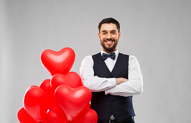 Image showing happy man with red heart shaped balloons