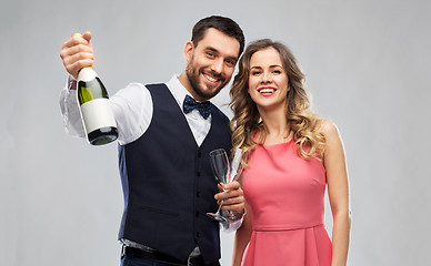 Image showing happy couple with bottle of champagne and glasses