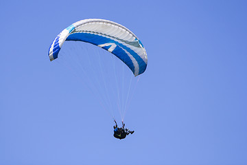 Image showing Paragliding in the blue sky as background extreme sport