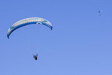 Image showing Paragliding in the blue sky as background extreme sport