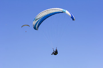 Image showing Paragliding in the blue sky as background extreme sport