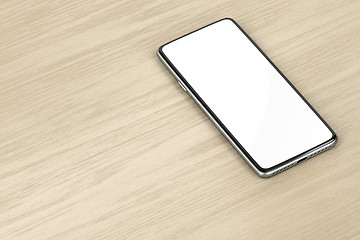 Image showing Smartphone on wood table