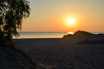 Image showing Sunset by an empty sandy beach