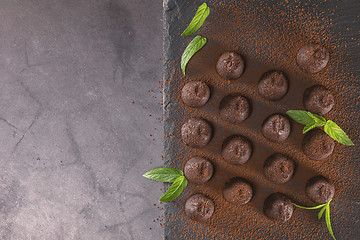 Image showing Top view of chocolate truffles powdered with cocoa