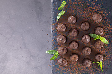 Image showing Top view of chocolate truffles powdered with cocoa