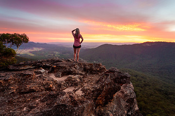 Image showing Adventurous female watching the sunset after a long day hiking in Blue Mountains