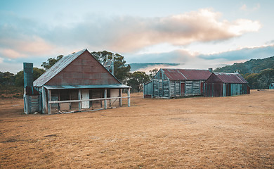 Image showing Log huts in Snowy Mountains Australia sunrise