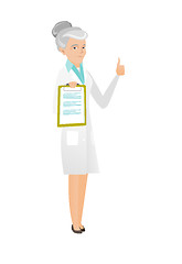 Image showing Caucasian doctor with clipboard giving thumb up.