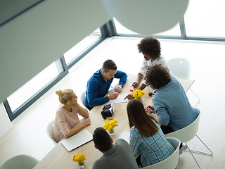 Image showing Multiethnic startup Business Team At A Meeting at modern office 