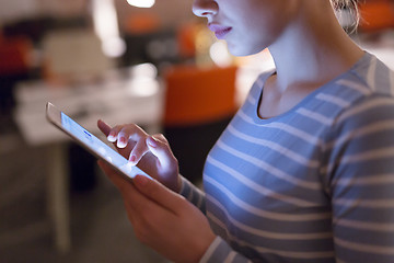 Image showing woman working on digital tablet in night office