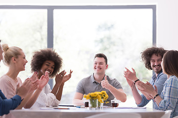 Image showing multiethnic startup Group of young business people celebrating s