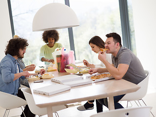 Image showing multiethnic group of happy friends lunch time