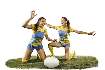 Image showing The young female rugby players isolated on white backround