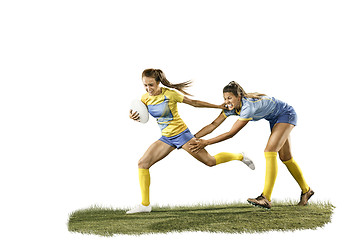 Image showing The young female rugby players isolated on white backround