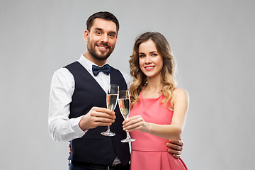 Image showing happy couple with champagne glasses toasting