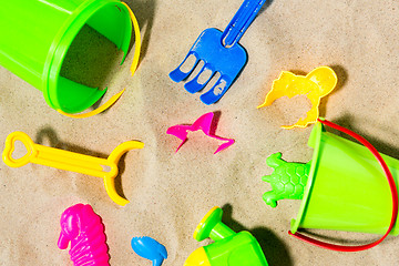 Image showing close up of sand toys kit on summer beach