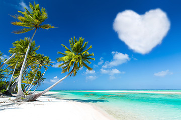 Image showing romantic beach with palms and heart shaped cloud