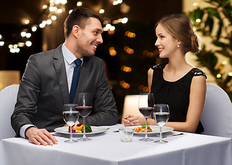 Image showing couple with food and red wine at restaurant