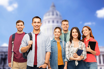 Image showing group of students with books over white house