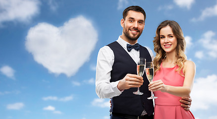 Image showing happy couple with champagne glasses toasting