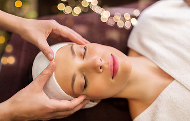 Image showing woman having face and head massage at spa