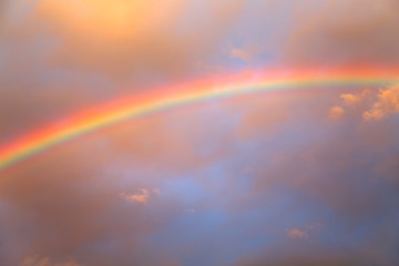 Image showing Rainbow agains cloudy sky