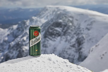 Image showing A can of Zlaty Bazant beer on a mountain