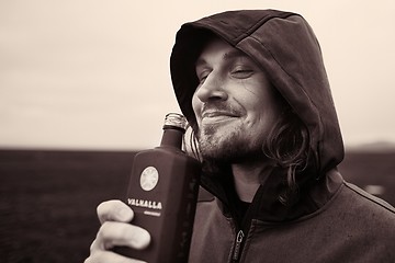 Image showing Hooded man drinking in Iceland