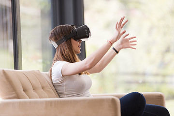 Image showing woman using VR-headset glasses of virtual reality