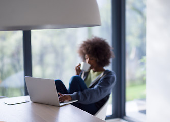 Image showing African American woman in the living room