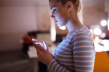 Image showing woman working on digital tablet in night office