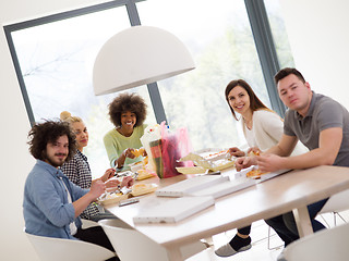 Image showing multiethnic group of happy friends lunch time