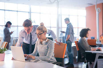 Image showing Two Business People Working With laptop in office