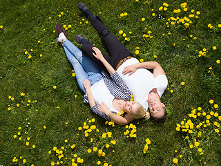 Image showing man and woman lying on the grass