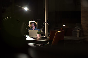 Image showing businessman relaxing at the desk