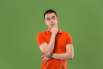 Image showing Young serious thoughtful businessman. Doubt concept.