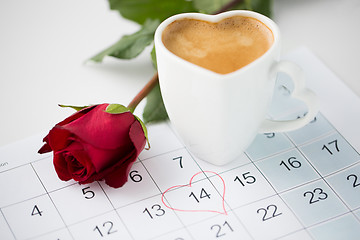 Image showing close up of calendar, heart, coffee and red rose