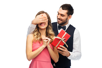 Image showing happy man giving woman surprise present