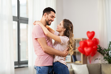 Image showing happy couple hugging at home on valentines day