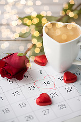 Image showing close up of calendar, hearts, coffee and red rose