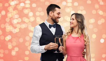 Image showing happy couple with champagne glasses toasting