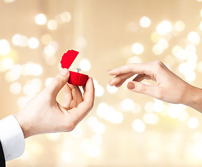 Image showing man giving diamond ring to woman on valentines day